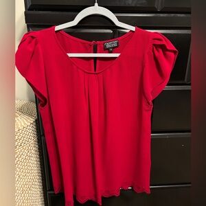 Red blouse with puff sleeve and etched detail